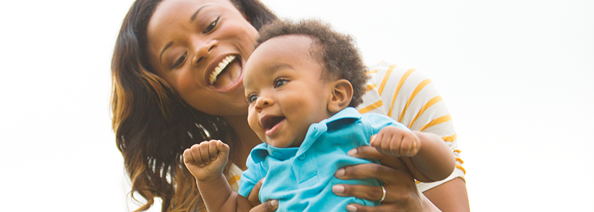Mom laughs with her baby