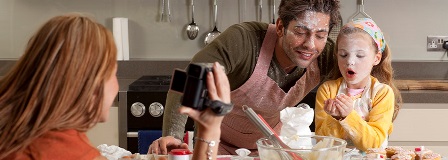 Family baking after having a flour fight