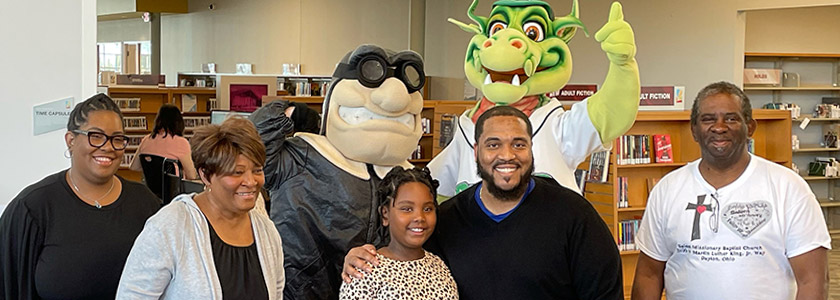 Dayton Metro Library Summer Challenge winner Noah Hairston and her family celebrates with Heater and Rudy