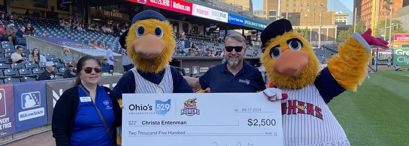 2024 Mud Hens Home Run Readers oversized check with Mud Hens Mascots